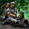 Bronze Kids and Dog on Log Sculpture