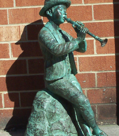 SRB46037 Bronze Sitting Boy with Flute Sculpture Metropolitan Galleries Inc.