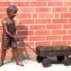 Bronze Boy pulling Wagon Sculpture