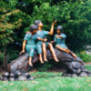 Bronze Children on Log with Butterflies Sculpture