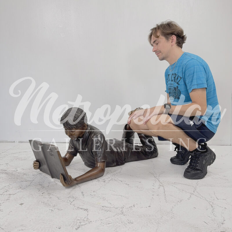 SRB49319 Bronze Laying Boy Reading Book Sculpture by Metropolitan Galleries Inc SCALE WM