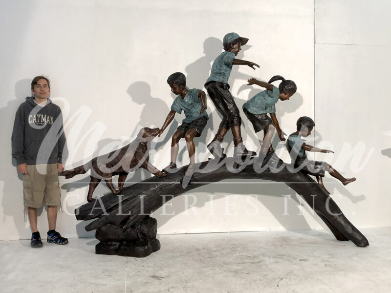 SRB052090 Bronze Four Children & Dog crossing Log Sculpture by Metropolitan Galleries Inc SCALE watermark