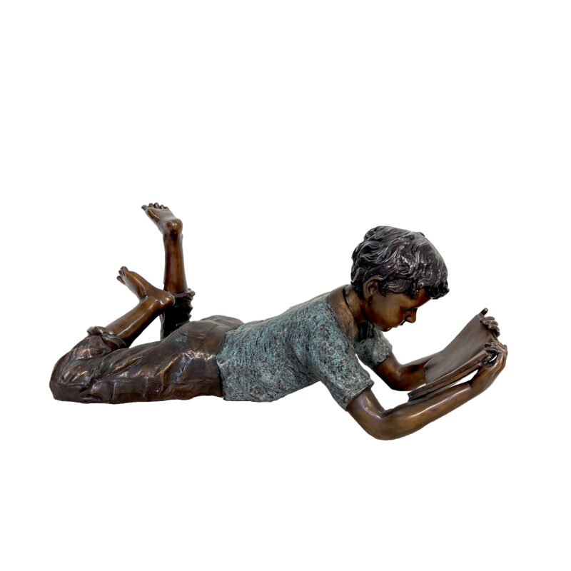 SRB705317 Bronze Boy on Belly Reading Book Sculpture in Three Tone Patina by Metropolitan Galleries Inc
